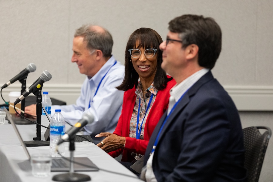 Three people serve on a panel discussion at OARnet meeting.