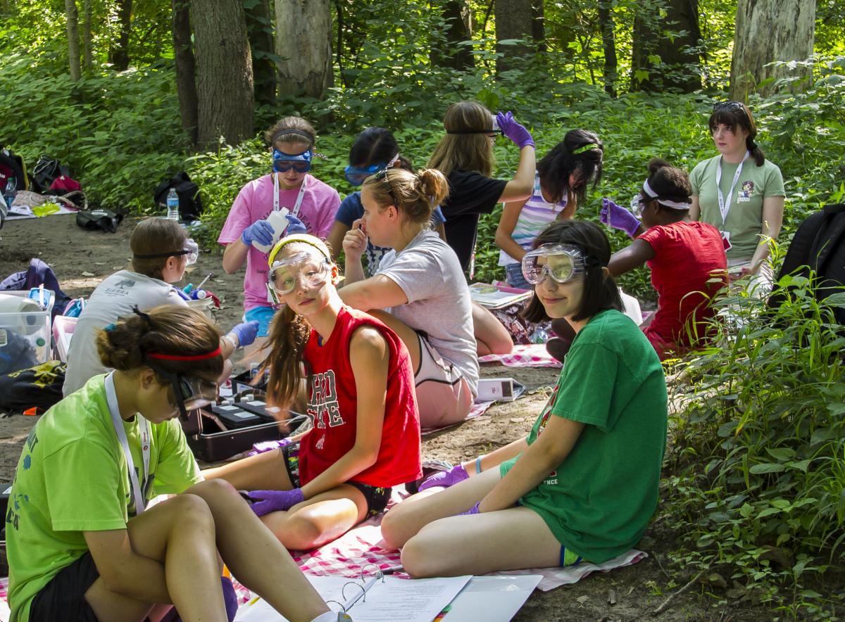 Lang with student in the field