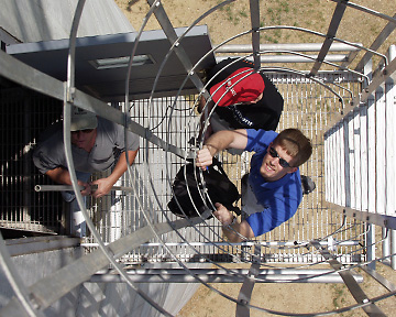 Engineers install equipment on a platform on the New Straitsville water tower.