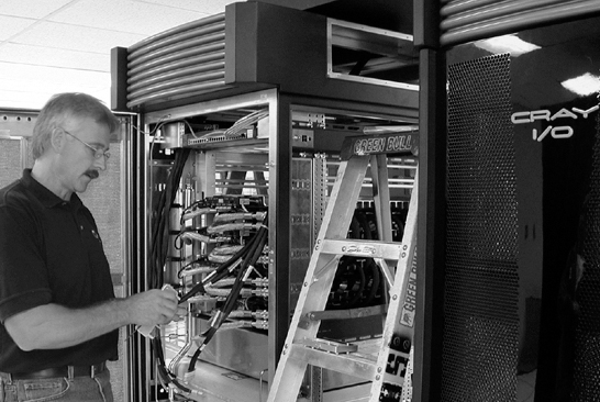 Engineer installs Cray system at the OSC-Springfield facility.