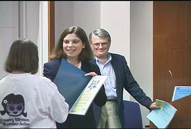 A student receives an award at YWSI, which OSC established in 1999. OSC initiated YWSI in 1999.